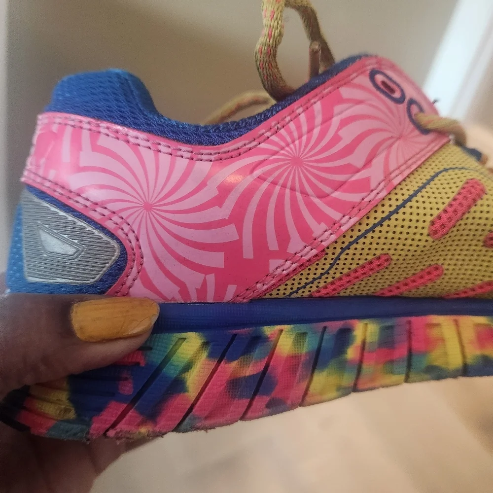 Fila multi color tennis shoe. Pink, yellow, and blue. Great tread. Yellow laces